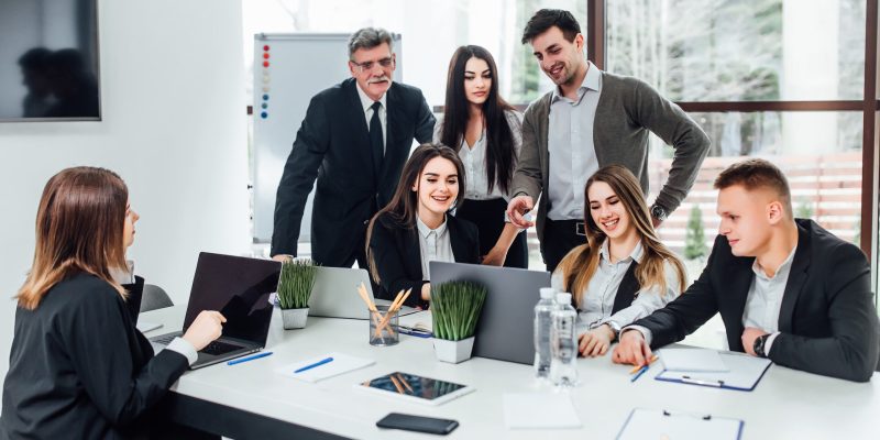 staff-meeting-group-young-modern-people-smart-casual-wear-discussing-something-while-working-creative-office-business-time Staff meeting. Group of young modern people in smart casual wear discussing something while working in the creative office . Business time..
